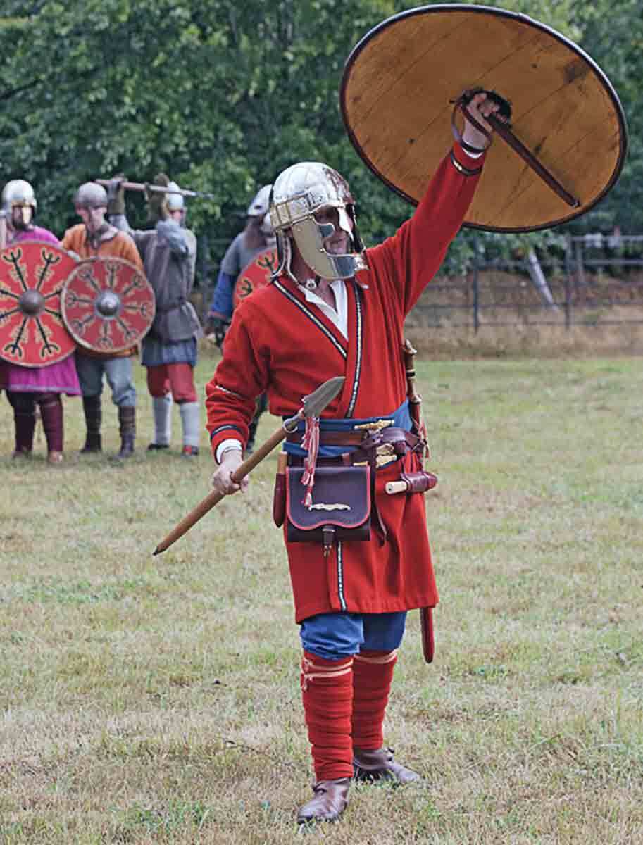 anglo saxon soldier raises shield