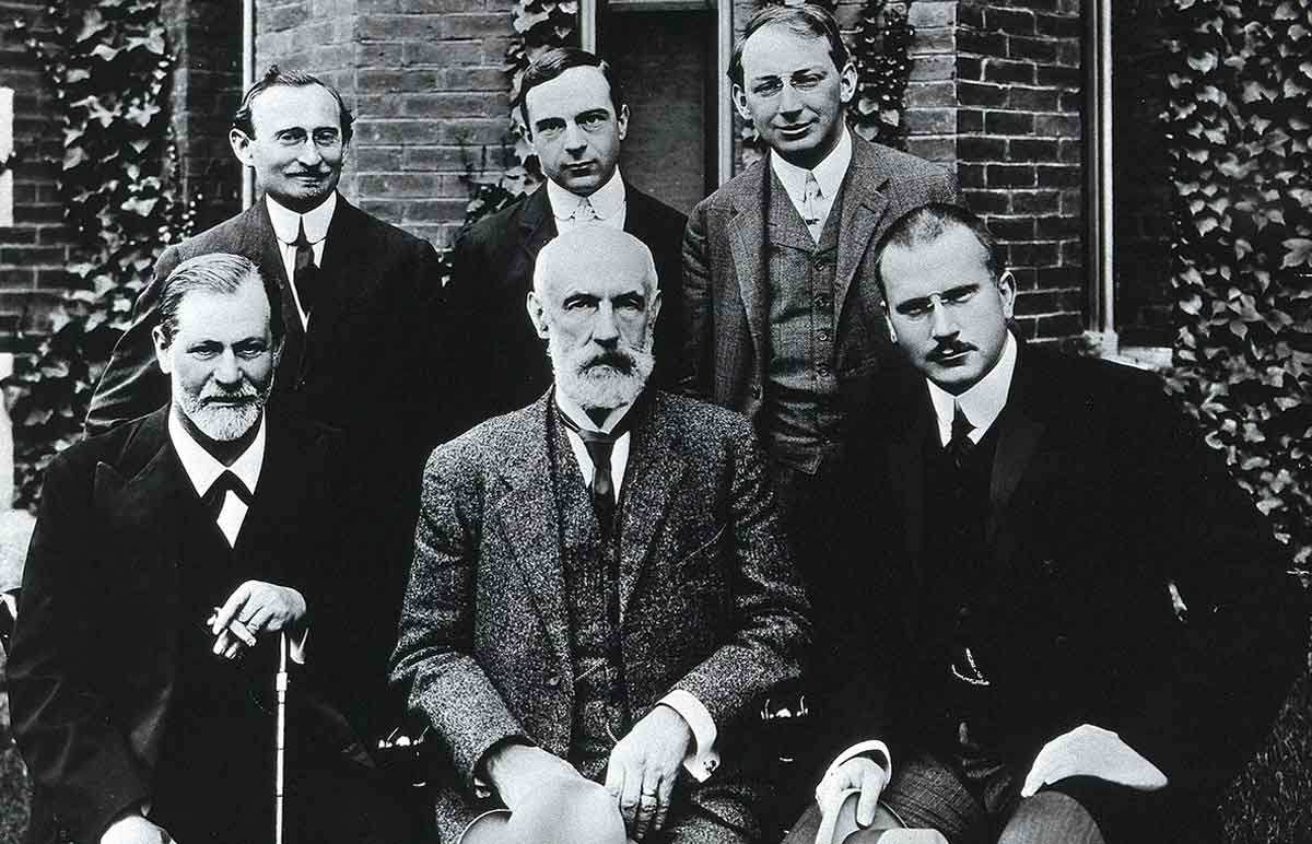 Photograph with Sigmund Freud sitting at the center and Carl Jung sitting at his right. Source: Wikimedia Commons