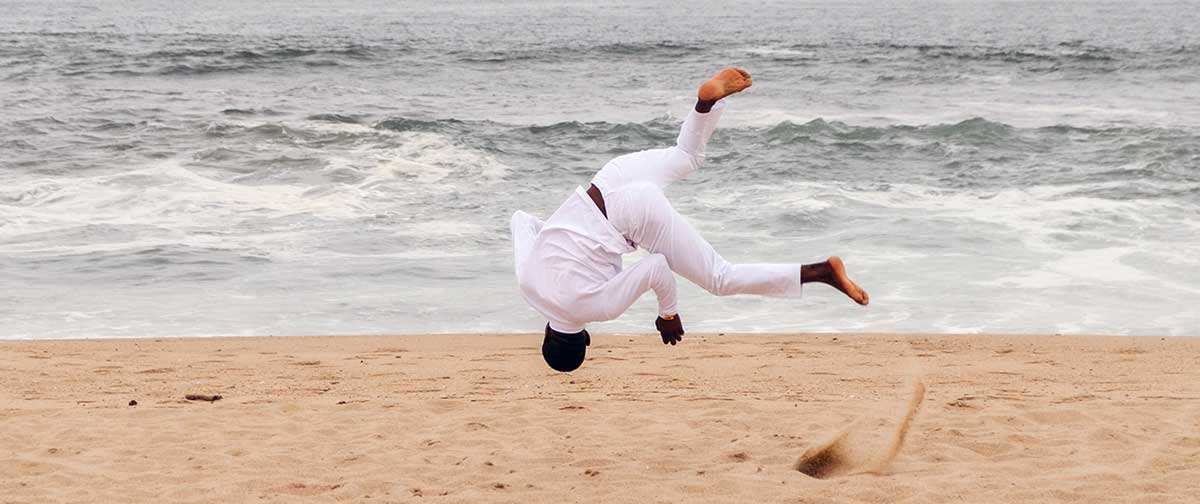 man salto capoeira beach brazil martial art