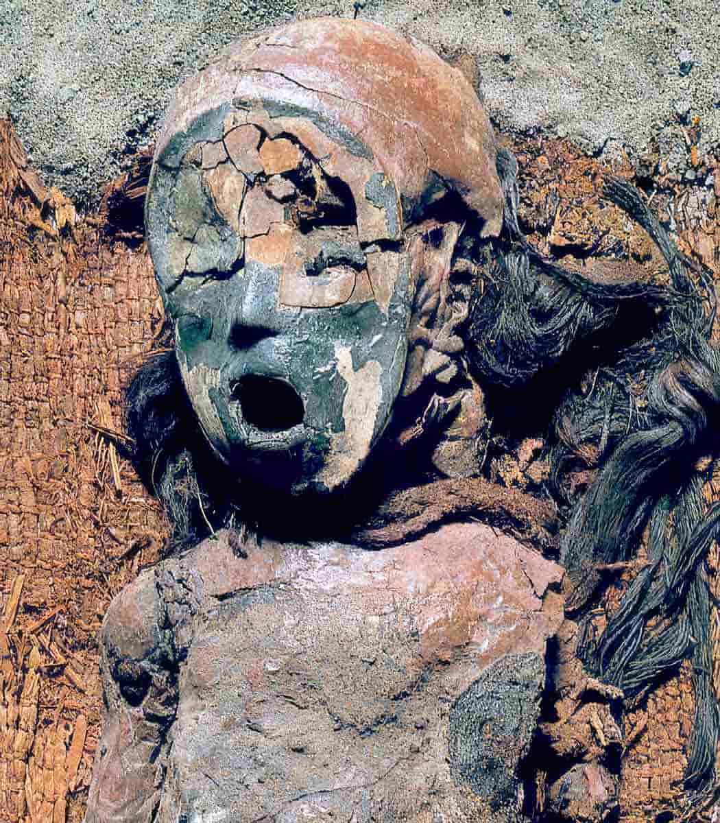 red chinchorro child mummy with helmet